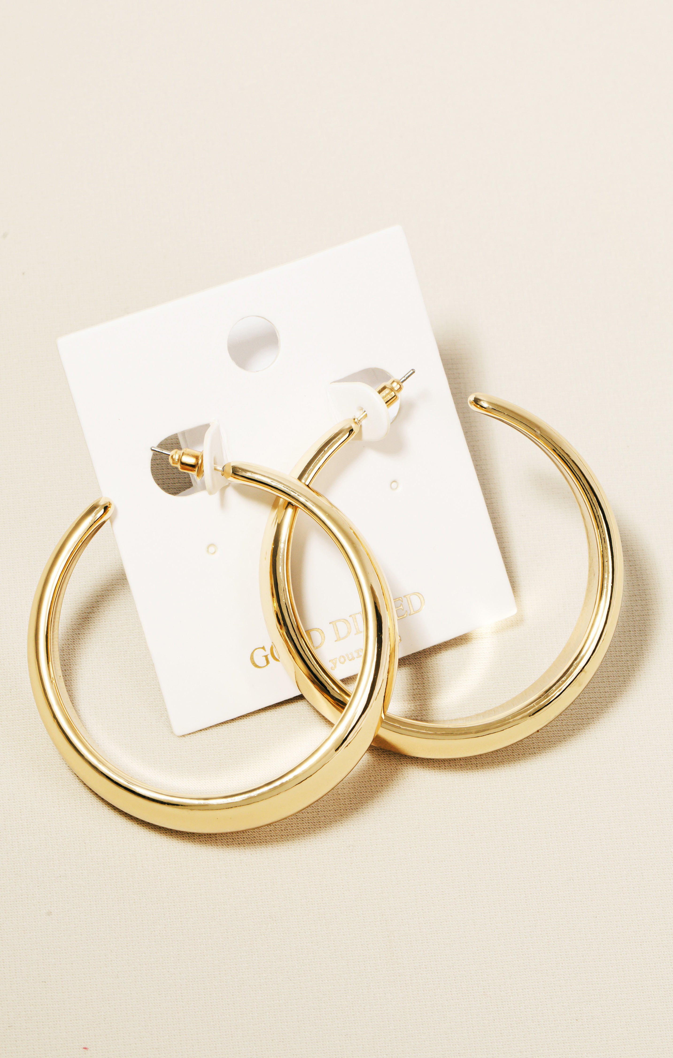 Gold Curved Hoop Earrings – Playful Twist Design